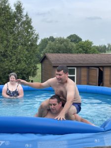 Me standing straight up in the pool while my brother sits on my shoulders.